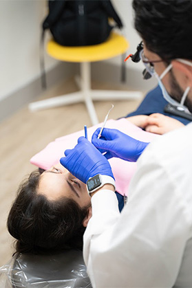 Dallas dentist performing a dental exam on a patient