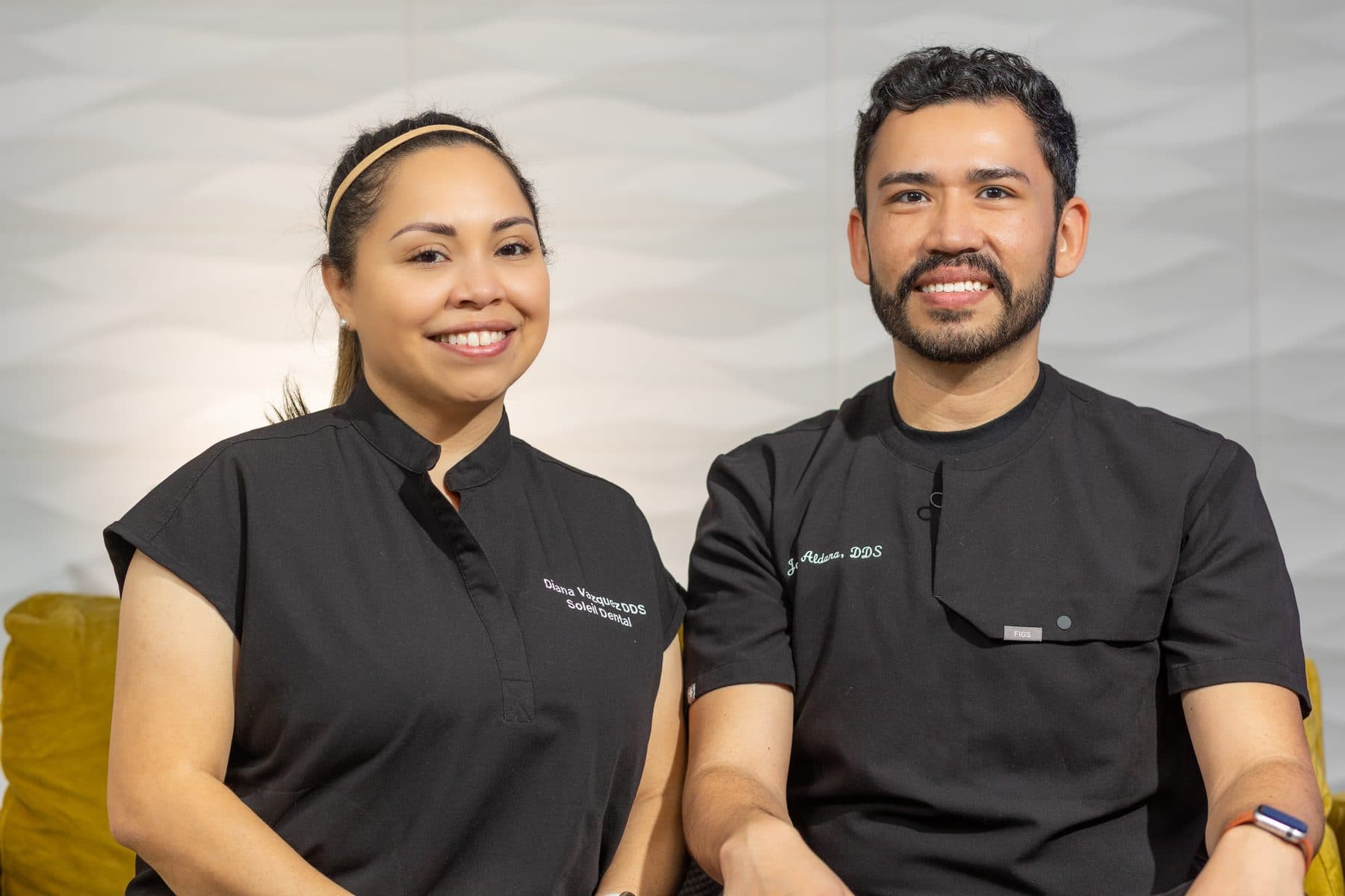 Dr. Jose Aldana and Dr. Diana Vazquez side by side in black Soleil scrubs