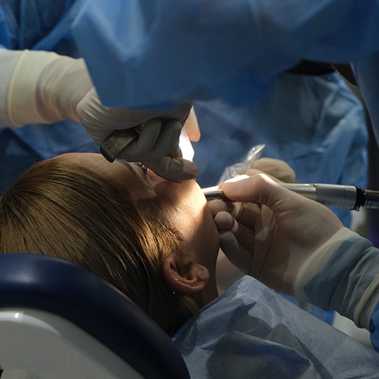 Dentist completing surgery