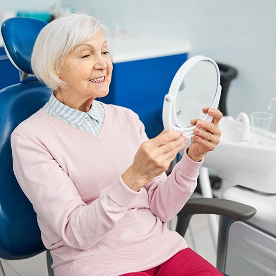 Woman smiling in the dental chair