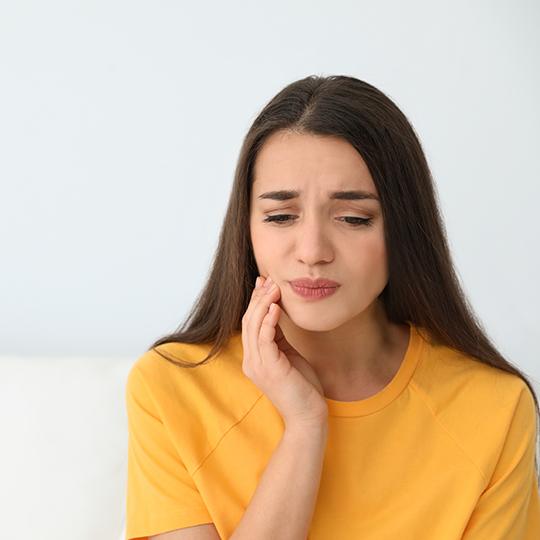 Illustration of infected, receding gums around dental implant