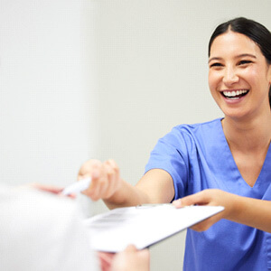 patient in dallas talking to the dentist about wisdom tooth extraction